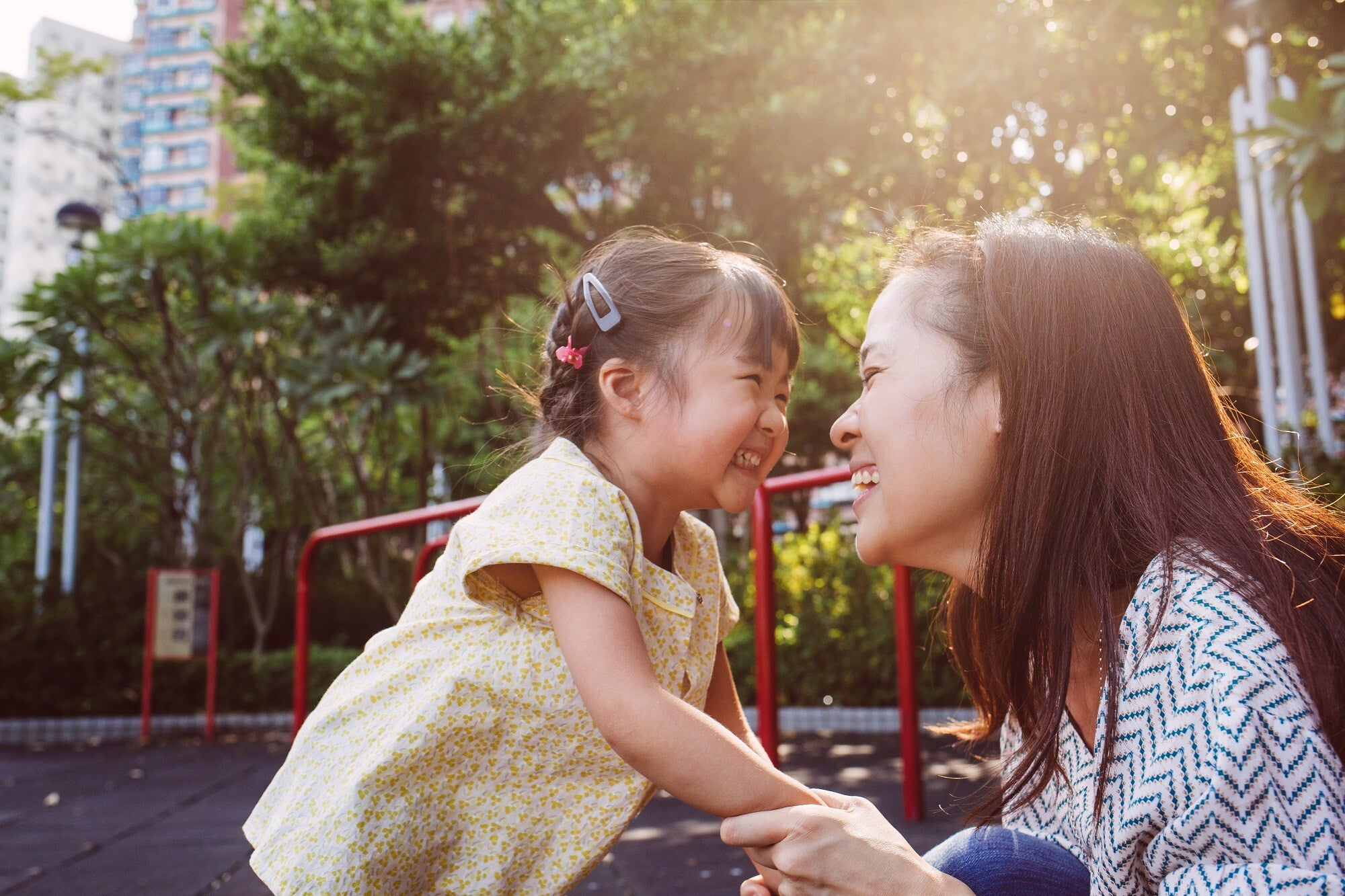Mother and daughter smiling at each other