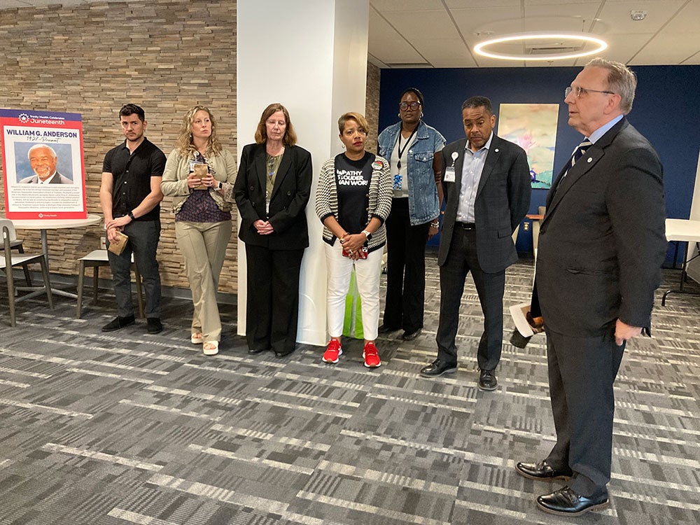 Mike Slubowski, president and CEO of Trinity Health, speaking to a group during the Commemoration 160th Anniversary of Juneteenth