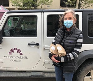 Serving TogetherImage: Feeding the Homeless in Columbus During COVID-19
